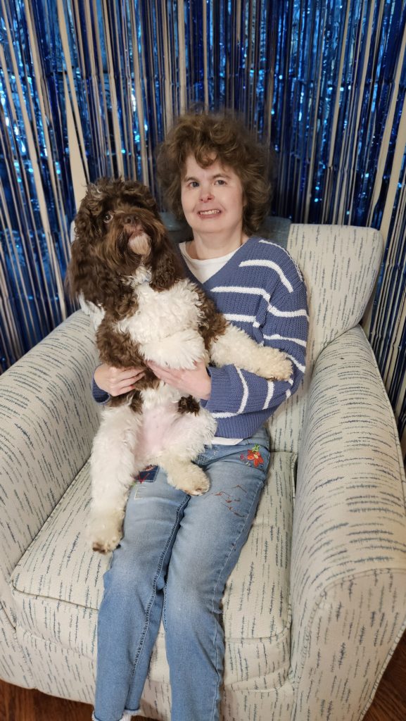 Baxter Huggins Montani, our Cockapoo and co-author of “Paws and Reflect: A Memory Journal Written by Your Dog,” posing with his family and book. A fun, heartfelt dog memory journal and keepsake gift for pet lovers, dog moms, and new puppy parents.