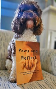 Baxter Huggins Montani, our Cockapoo and co-author of “Paws and Reflect: A Memory Journal Written by Your Dog,” posing with his family and book. A fun, heartfelt dog memory journal and keepsake gift for pet lovers, dog moms, and new puppy parents.